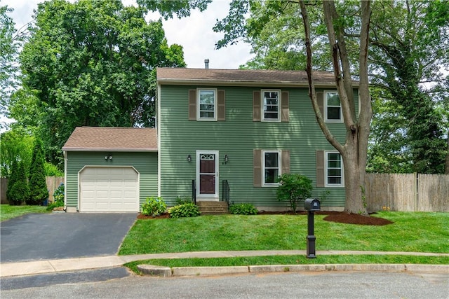 65 Jeri Lynn Cir, Warwick, RI 02886 - colonial-style house featuring a garage and asphalt driveway