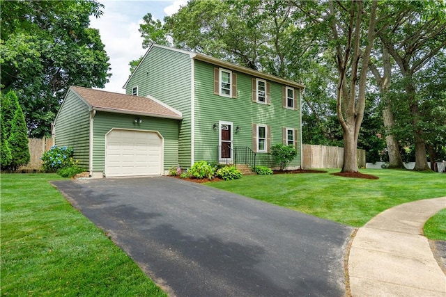 65 Jeri Lynn Cir, Warwick, RI 02886 - colonial home with a garage and asphalt driveway