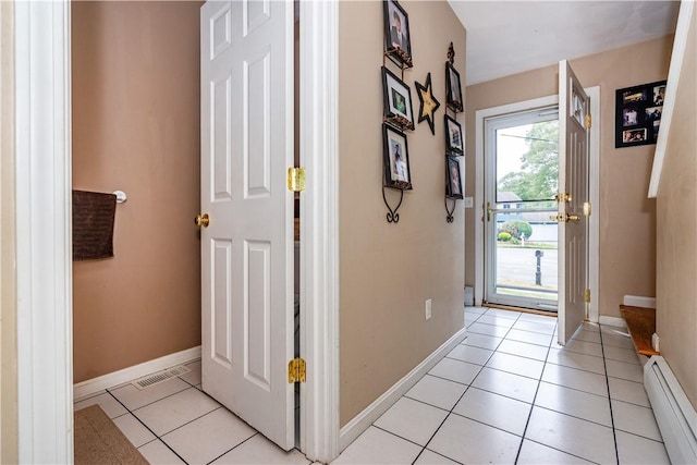 65 Jeri Lynn Cir, Warwick, RI 02886 - entrance foyer with a baseboard heating unit and light tile patterned flooring
