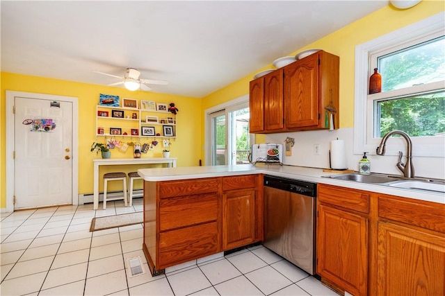 65 Jeri Lynn Cir, Warwick, RI 02886 - kitchen featuring stainless steel dishwasher, a baseboard heating unit, light countertops, and a peninsula