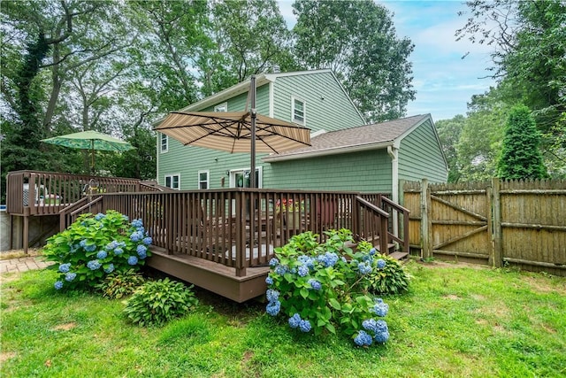 65 Jeri Lynn Cir, Warwick, RI 02886 - rear view of house with a wooden deck, a gate, and a shingled roof