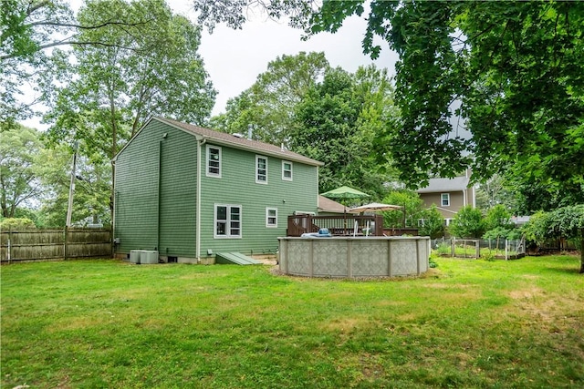 65 Jeri Lynn Cir, Warwick, RI 02886 - rear view of house featuring a fenced backyard and a wooden deck
