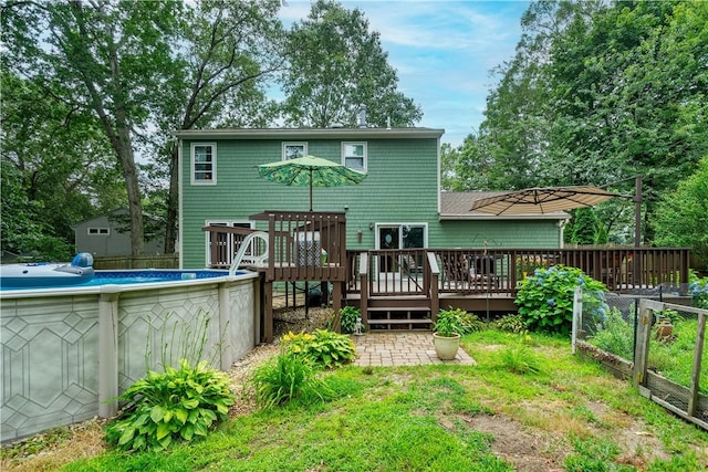 65 Jeri Lynn Cir, Warwick, RI 02886 - rear view of house with a deck and an outdoor pool