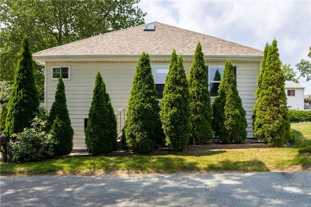 73 Fessenden St, Warwick, RI 02886 - view of side of home featuring a shingled roof