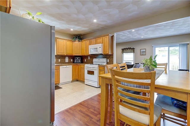 73 Fessenden St, Warwick, RI 02886 - kitchen featuring white appliances, tasteful backsplash, recessed lighting, and light tile patterned floors