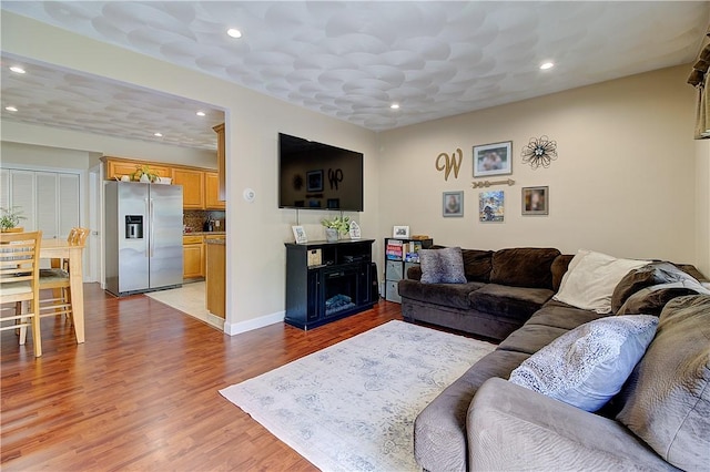 73 Fessenden St, Warwick, RI 02886 - living area with wood finished floors, recessed lighting, and a fireplace