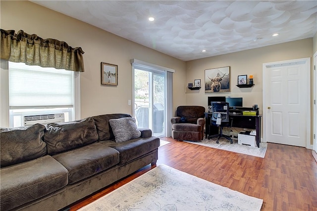 73 Fessenden St, Warwick, RI 02886 - living room with cooling unit, wood finished floors, an office area, and recessed lighting