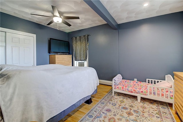 73 Fessenden St, Warwick, RI 02886 - bedroom featuring light wood-style flooring, ceiling fan, cooling unit, and beam ceiling