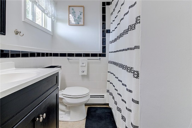 73 Fessenden St, Warwick, RI 02886 - bathroom featuring baseboard heating, vanity, tile patterned floors, curtained shower, and tile walls