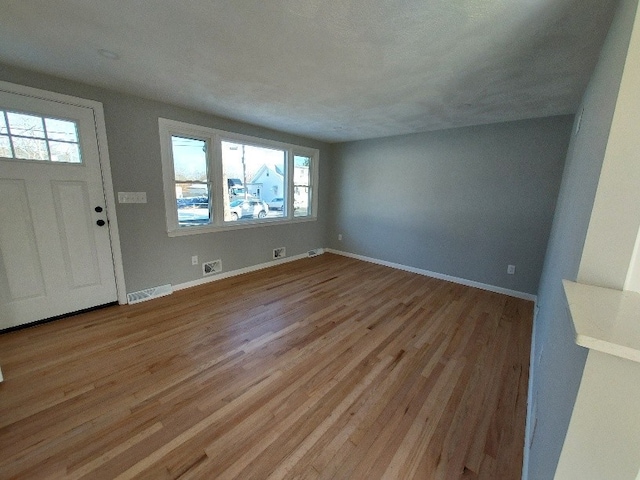 16 Fyffe Ave, Cranston, RI 02920 - entrance foyer with plenty of natural light and light wood finished floors