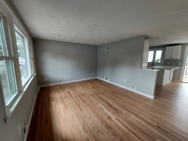16 Fyffe Ave, Cranston, RI 02920 - unfurnished living room featuring light wood finished floors and baseboards