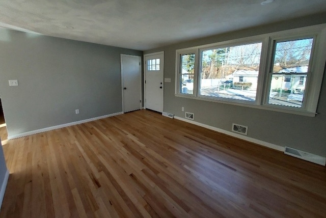 16 Fyffe Ave, Cranston, RI 02920 - entrance foyer with light wood-style floors and baseboards