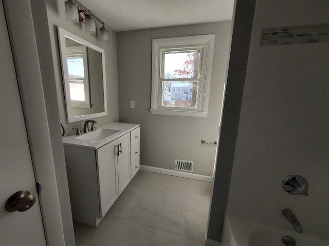 16 Fyffe Ave, Cranston, RI 02920 - full bathroom with vanity, marble look tile flooring, and shower / bath combination