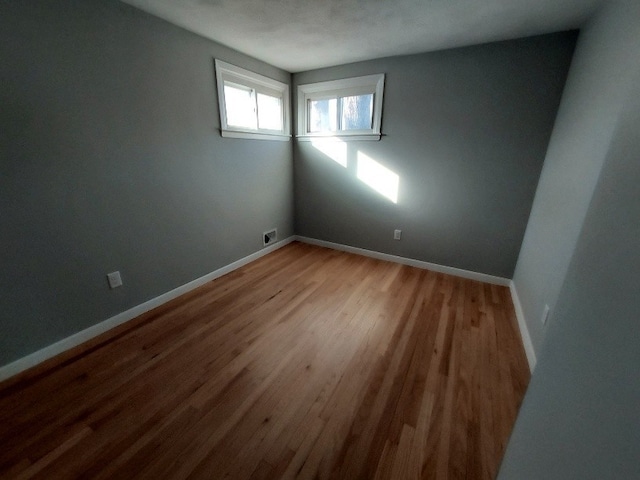 16 Fyffe Ave, Cranston, RI 02920 - empty room featuring wood finished floors and baseboards