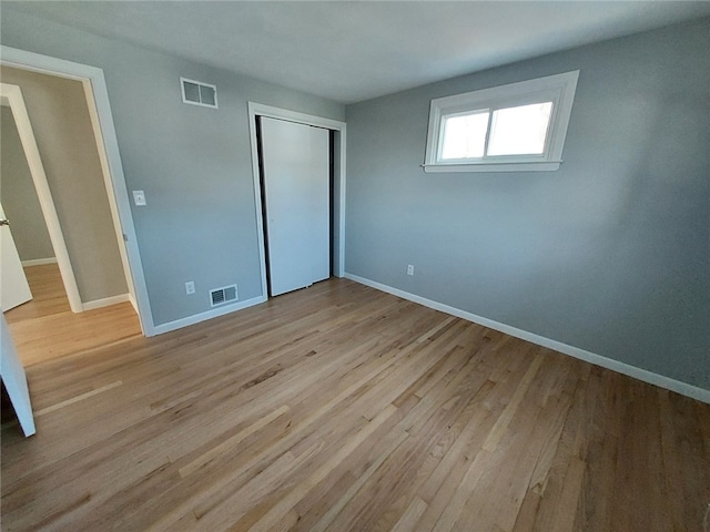 16 Fyffe Ave, Cranston, RI 02920 - unfurnished bedroom with a closet and wood finished floors