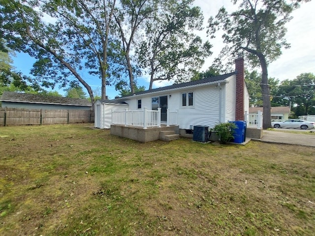 16 Fyffe Ave, Cranston, RI 02920 - back of house featuring a chimney and a storage shed