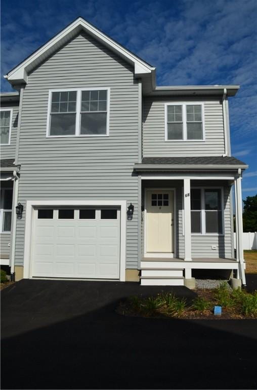 68 Greene St Unit 5, Warwick, RI 02886 - view of front of house featuring an attached garage and asphalt driveway