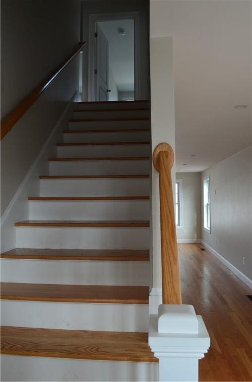 68 Greene St Unit 5, Warwick, RI 02886 - staircase featuring wood finished floors and baseboards