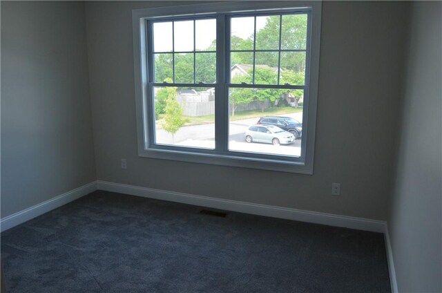 68 Greene St Unit 5, Warwick, RI 02886 - spare room featuring healthy amount of natural light and dark carpet