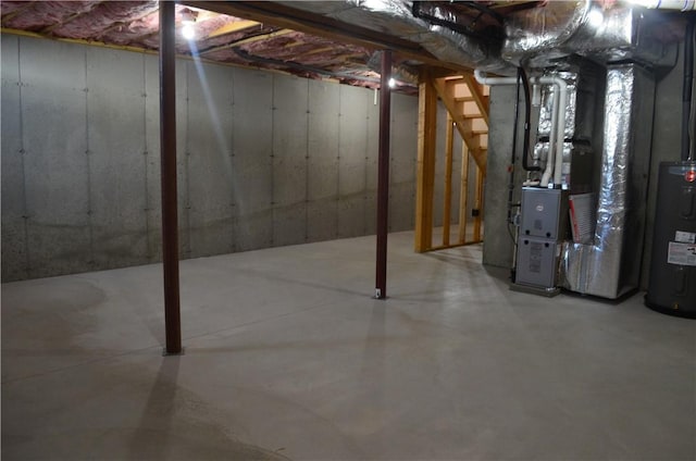 68 Greene St Unit 5, Warwick, RI 02886 - unfinished below grade area featuring water heater and heating unit