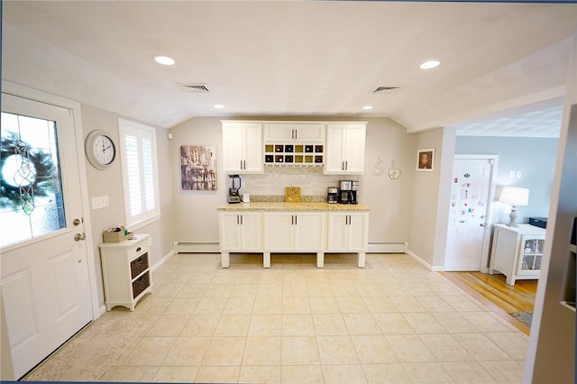 14 Willow Dr, Cranston, RI 02920 - kitchen with lofted ceiling, white cabinetry, backsplash, recessed lighting, and a baseboard radiator