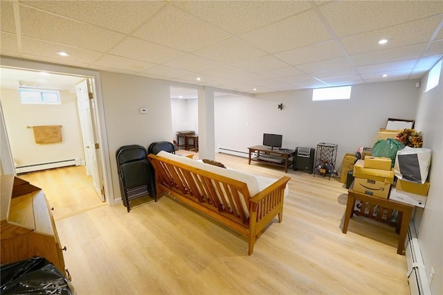 14 Willow Dr, Cranston, RI 02920 - living area featuring light wood-style flooring, a baseboard radiator, a paneled ceiling, recessed lighting, and a baseboard heating unit