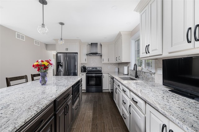 32 Susan Dr, Cumberland, RI 02864 - kitchen with stainless steel refrigerator with ice dispenser, black electric range oven, wall chimney range hood, white cabinetry, and tasteful backsplash