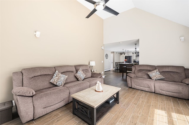 32 Susan Dr, Cumberland, RI 02864 - living area featuring high vaulted ceiling, light wood-style flooring, ceiling fan, and baseboard heating