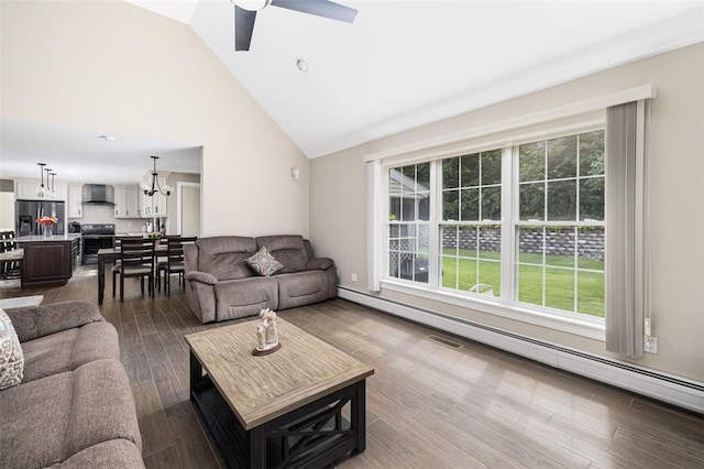 32 Susan Dr, Cumberland, RI 02864 - living room featuring healthy amount of natural light, ceiling fan, wood finished floors, a baseboard radiator, and high vaulted ceiling
