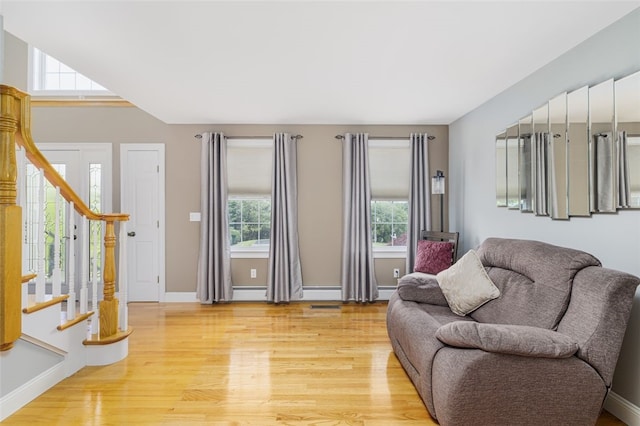 32 Susan Dr, Cumberland, RI 02864 - living area with light wood finished floors and stairway