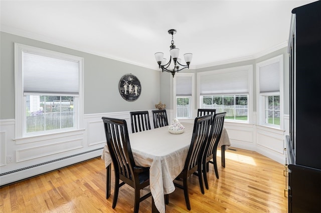 32 Susan Dr, Cumberland, RI 02864 - dining space featuring a chandelier, baseboard heating, crown molding, a decorative wall, and light wood-style floors
