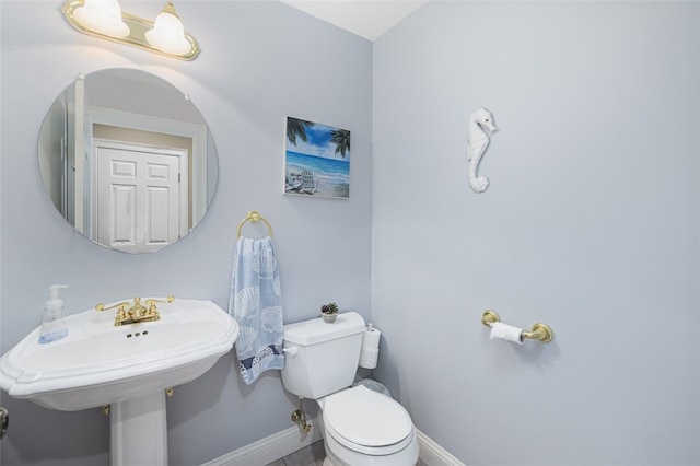 32 Susan Dr, Cumberland, RI 02864 - half bathroom with baseboards and toilet