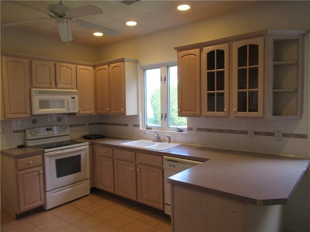 73 Orchard Meadows Dr Unit 73, Smithfield, RI 02917 - kitchen featuring white appliances, a peninsula, glass insert cabinets, light tile patterned floors, and backsplash