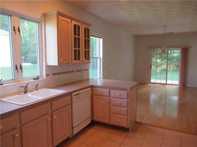 73 Orchard Meadows Dr Unit 73, Smithfield, RI 02917 - kitchen featuring dishwasher, a peninsula, glass insert cabinets, and healthy amount of natural light