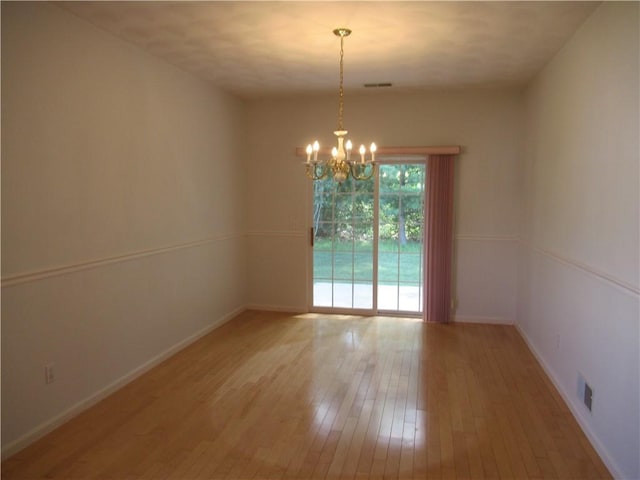 73 Orchard Meadows Dr Unit 73, Smithfield, RI 02917 - spare room featuring hardwood / wood-style floors and a chandelier