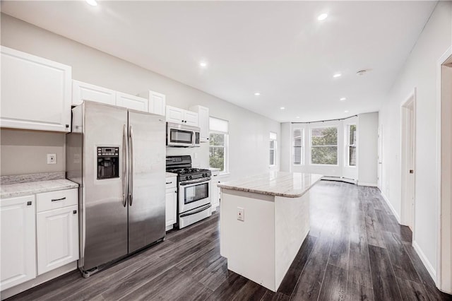 15 Wendell St, Providence, RI 02909 - kitchen featuring stainless steel appliances, white cabinets, a center island, dark wood-type flooring, and recessed lighting