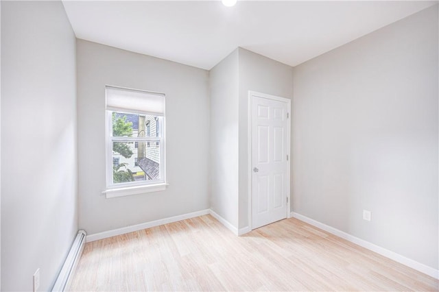 15 Wendell St, Providence, RI 02909 - unfurnished room featuring baseboard heating and light wood-type flooring