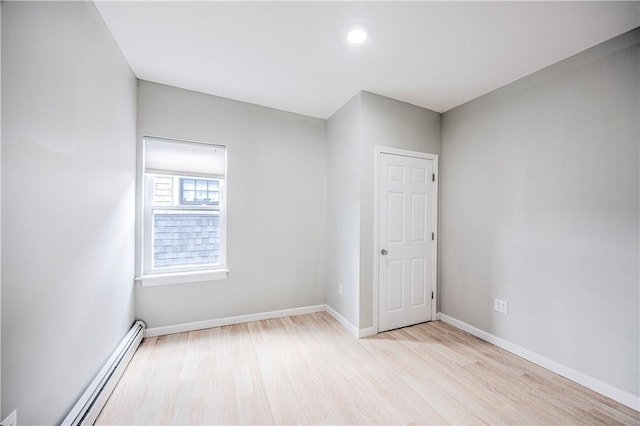 15 Wendell St, Providence, RI 02909 - unfurnished room featuring a baseboard radiator, wood finished floors, and recessed lighting