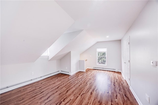 15 Wendell St, Providence, RI 02909 - additional living space with baseboard heating, wood finished floors, lofted ceiling, and recessed lighting