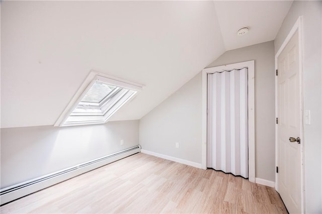 15 Wendell St, Providence, RI 02909 - additional living space featuring a baseboard heating unit, lofted ceiling, a skylight, and light wood finished floors