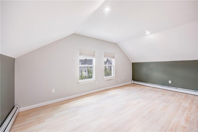 15 Wendell St, Providence, RI 02909 - additional living space with a baseboard heating unit, lofted ceiling, and light wood finished floors
