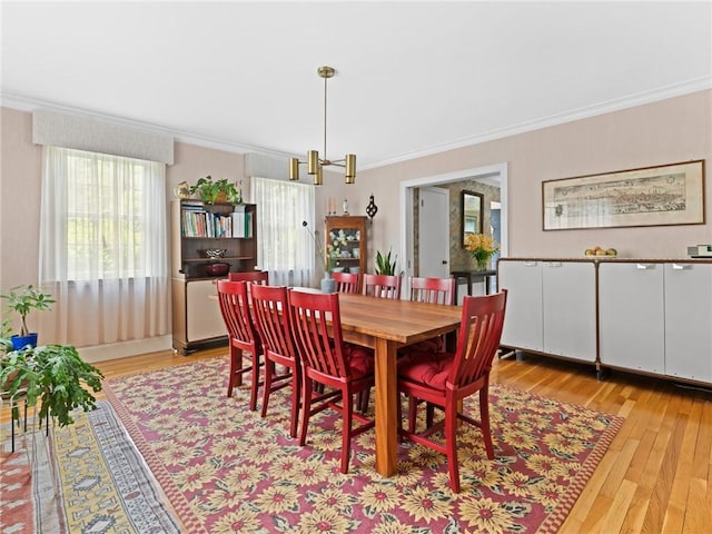 173 Gaskill St, Woonsocket, RI 02895 - dining space with ornamental molding and light wood-style flooring