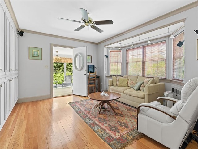 173 Gaskill St, Woonsocket, RI 02895 - living room featuring a ceiling fan, light wood finished floors, and crown molding