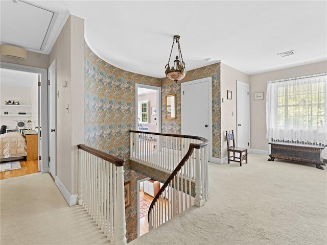 173 Gaskill St, Woonsocket, RI 02895 - hall with an upstairs landing, healthy amount of natural light, carpet, wallpapered walls, and ornamental molding