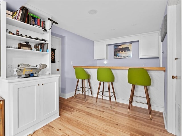 173 Gaskill St, Woonsocket, RI 02895 - indoor dry bar with light wood finished floors and baseboards