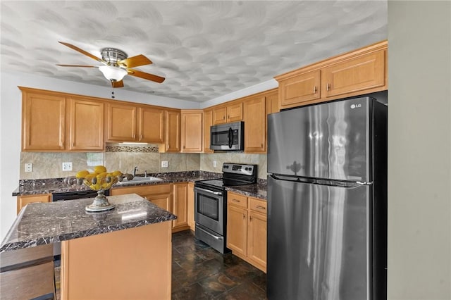 1 Lisi Ln Unit 1, Providence, RI 02904 - kitchen featuring stainless steel appliances, a center island, tasteful backsplash, a ceiling fan, and dark stone countertops