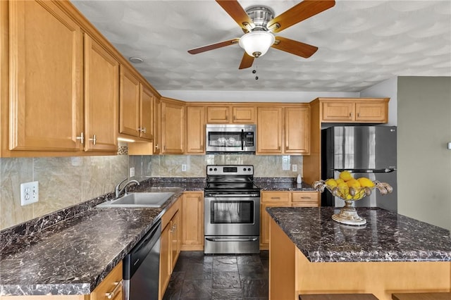 1 Lisi Ln Unit 1, Providence, RI 02904 - kitchen with stainless steel appliances, ceiling fan, stone tile floors, backsplash, and dark stone counters