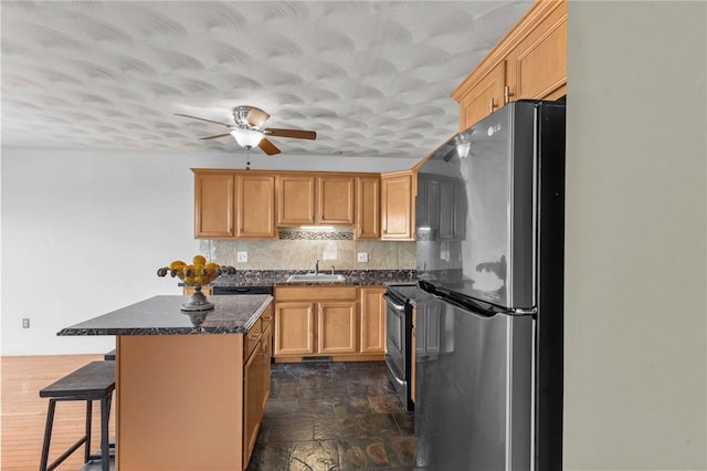 1 Lisi Ln Unit 1, Providence, RI 02904 - kitchen featuring stainless steel appliances, a center island, decorative backsplash, a breakfast bar, and a ceiling fan
