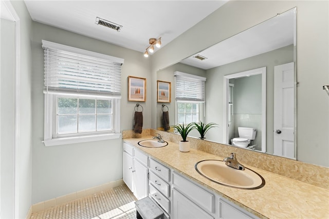 85 N Cobble Hill Rd, Warwick, RI 02886 - bathroom featuring double vanity and tile patterned flooring