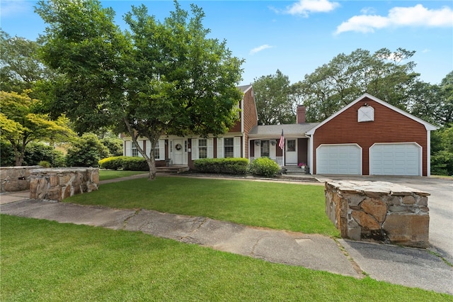 85 N Cobble Hill Rd, Warwick, RI 02886 - view of front of house featuring a chimney, driveway, a garage, and a front yard
